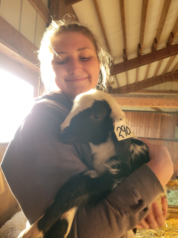 Olivia Renn holding a goat.