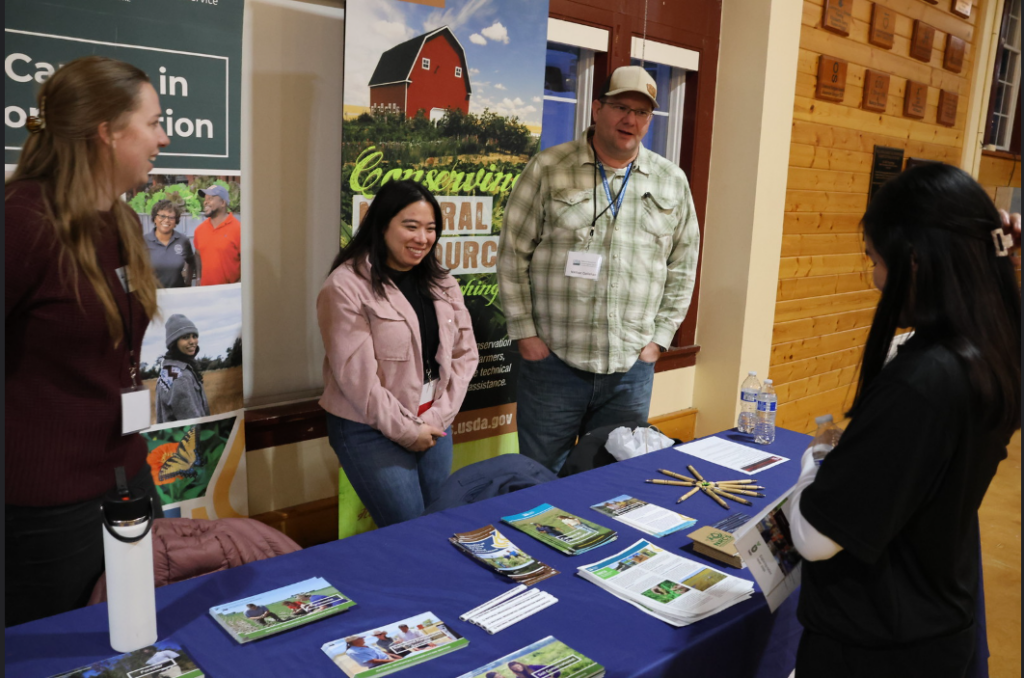 Conservine, a company related to CAHNRS majors, has representatives talk to attendees at the CAHNRS Involvement and Networking Night.