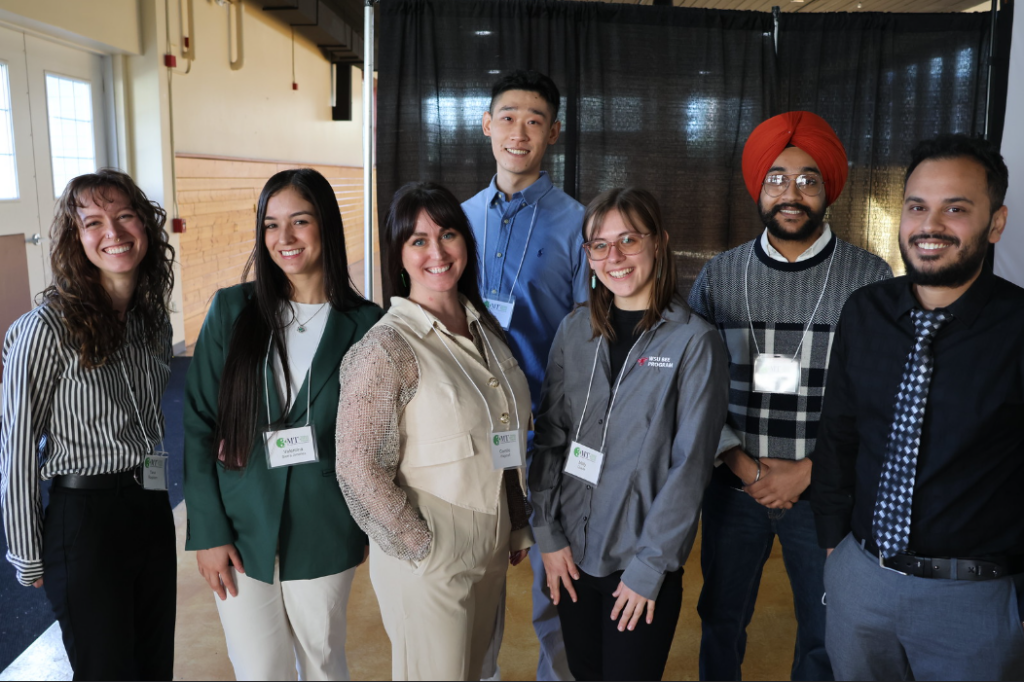 the CAHNRS 3MT winners are standing together with smiles on their faces. The winners include Camille Wagstaff, Molly Quade, Bhupinderjeet Singh, Yuan Su, S M Hasan Sharhriar Rahat, Tana Rayburn, and Valentina Sierra Jiminez.