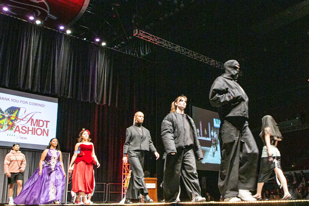 Various fashion show looks strut the runway at the AMDT Fashion Show 2025