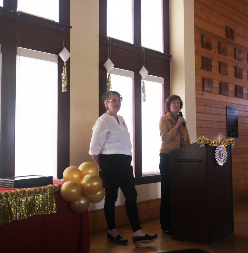 Kimi Lucas speaking on her nomination of Kat Odell, with Kat standing alongside her.