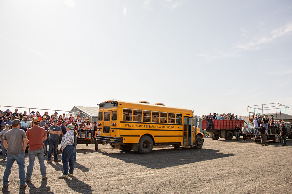 A school bus transports folks to more field day activities.