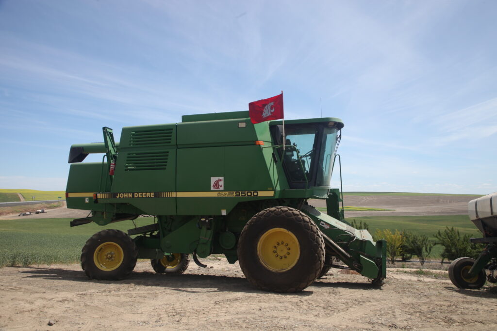 A tractor featuring the WSU logo and flag.