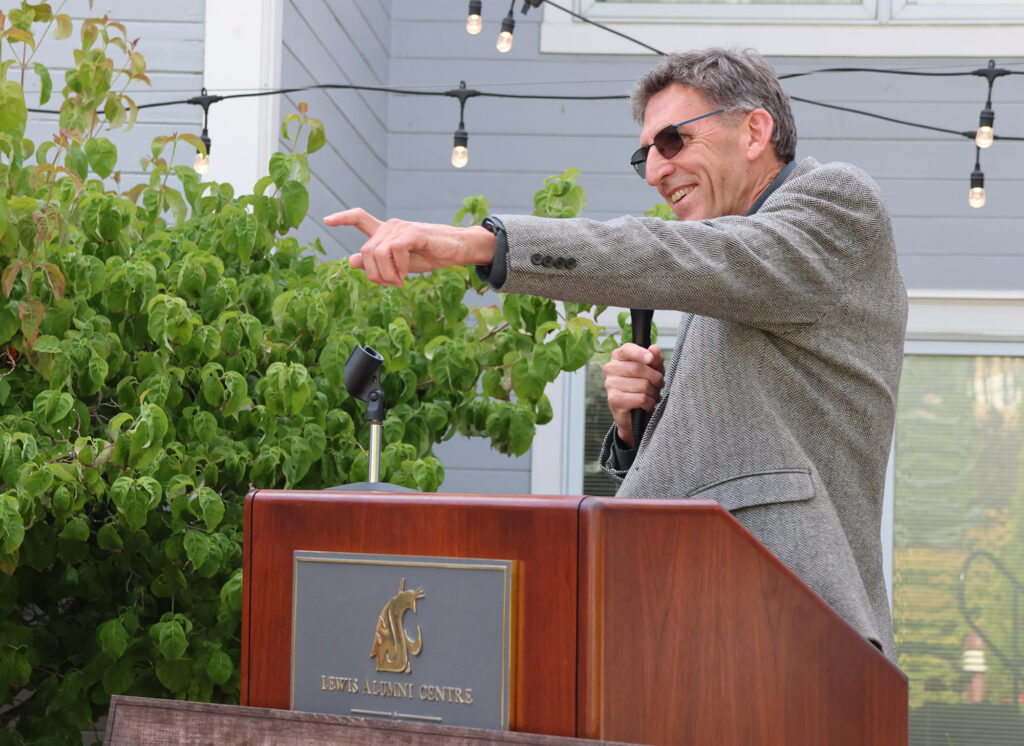 Scot Hulbert, Acting Dean of CAHNRS, points during his talk at the Lewis Alumni Centre,  a big smile on his face.