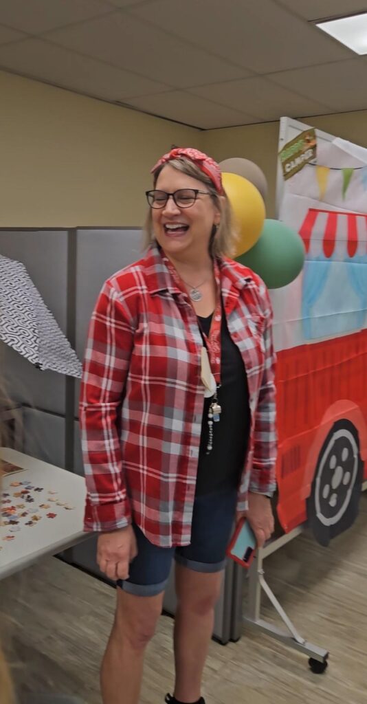 a member of the Business Center wears plaid and a bandana to match the theme