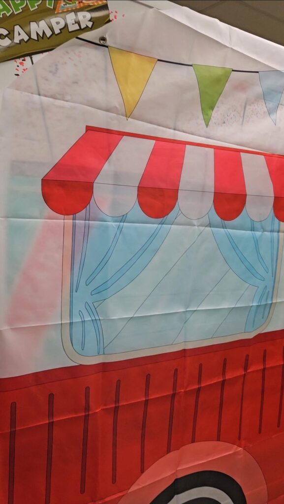 a tarp with a camper drawing