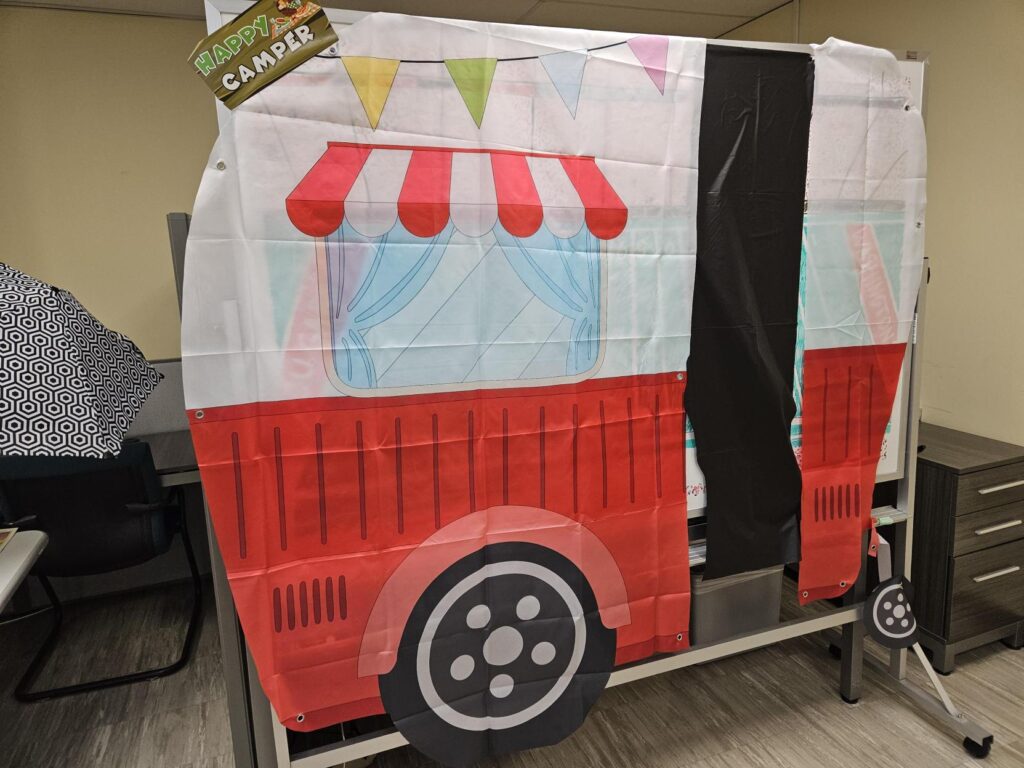 A tarp depicting a camper