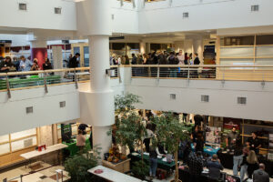 Two floors of Lighty Student Services building are full of excited students meeting employers at booths for the Career Fair and Networking Night