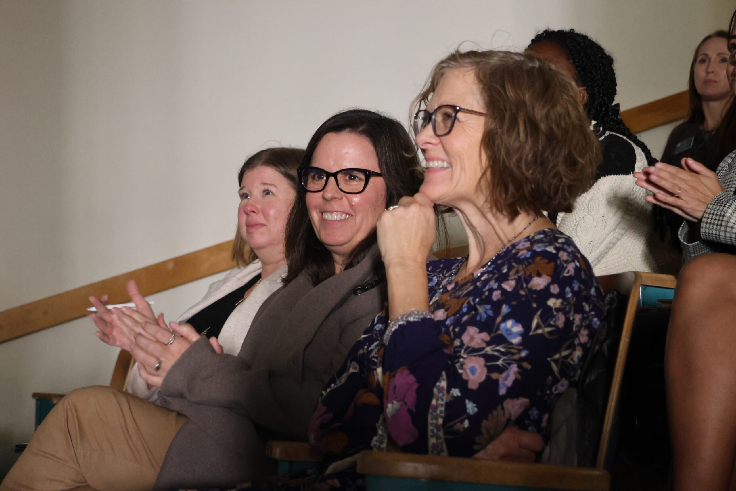 Employees of the SSAP office and CAHNRS, Anna Warner, Colette Casavant, and Judy Hopkins, sit excitedly waiting for the first ever All-CAHNRS Meeting to commence 