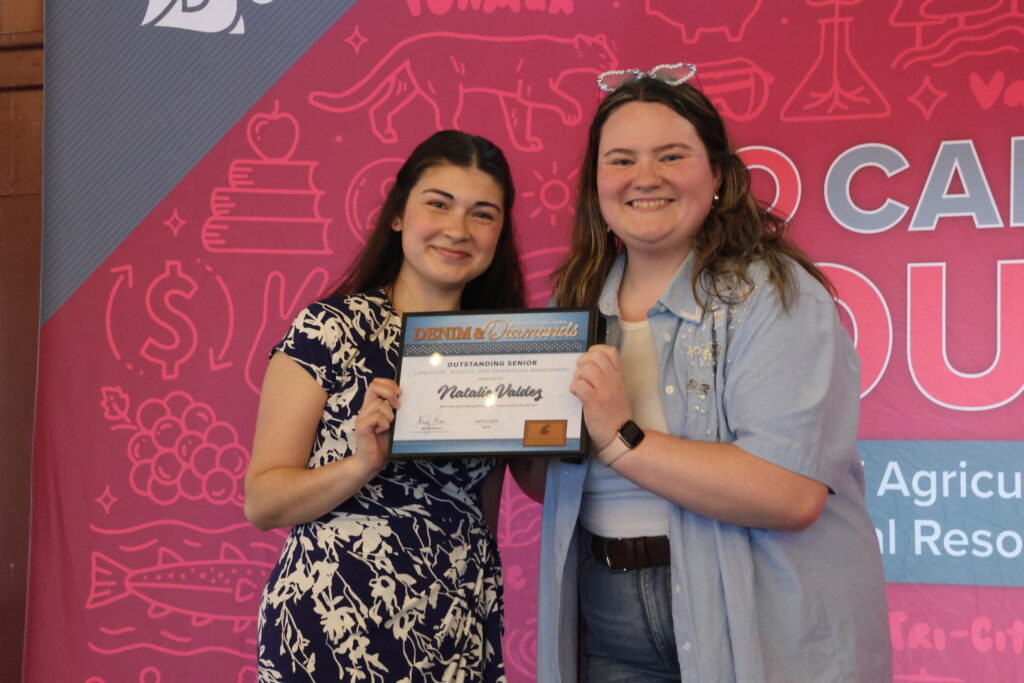 a student being presented an award at CAHNRS Student Awards 2025