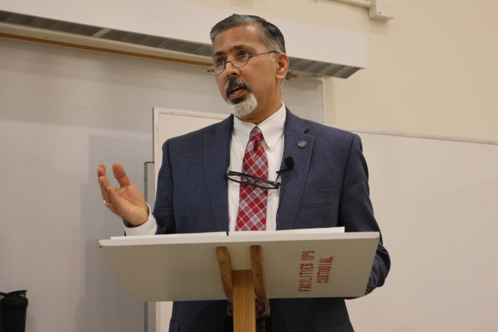 Dean Khosla gives an opening address at the CAHNRS Town Hall wearing his official WSU tartan tie.