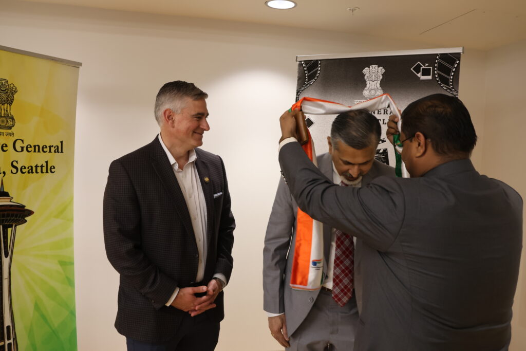 Dean Khosla receives a recognition ribbon from the Indian Consulate.