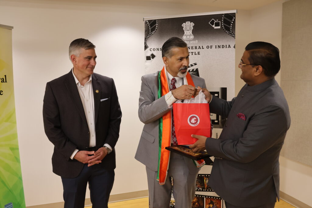 Dean Khosla presents a gift to the Indian consulate.