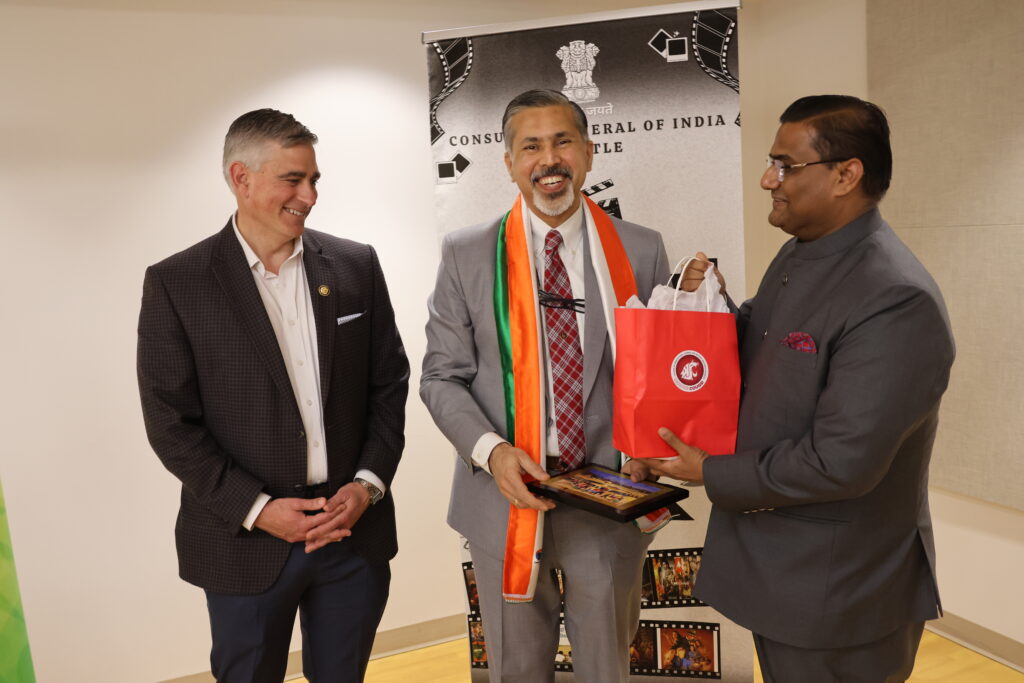 Dean Khosla gives a gift to the India Consulate.