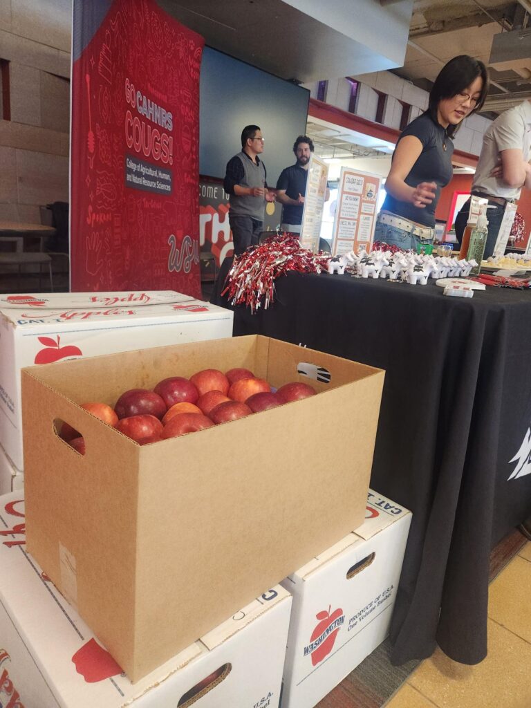 Cosmic Crisp© apples and other goodies are displayed at the National Ag Day display in the CUB.