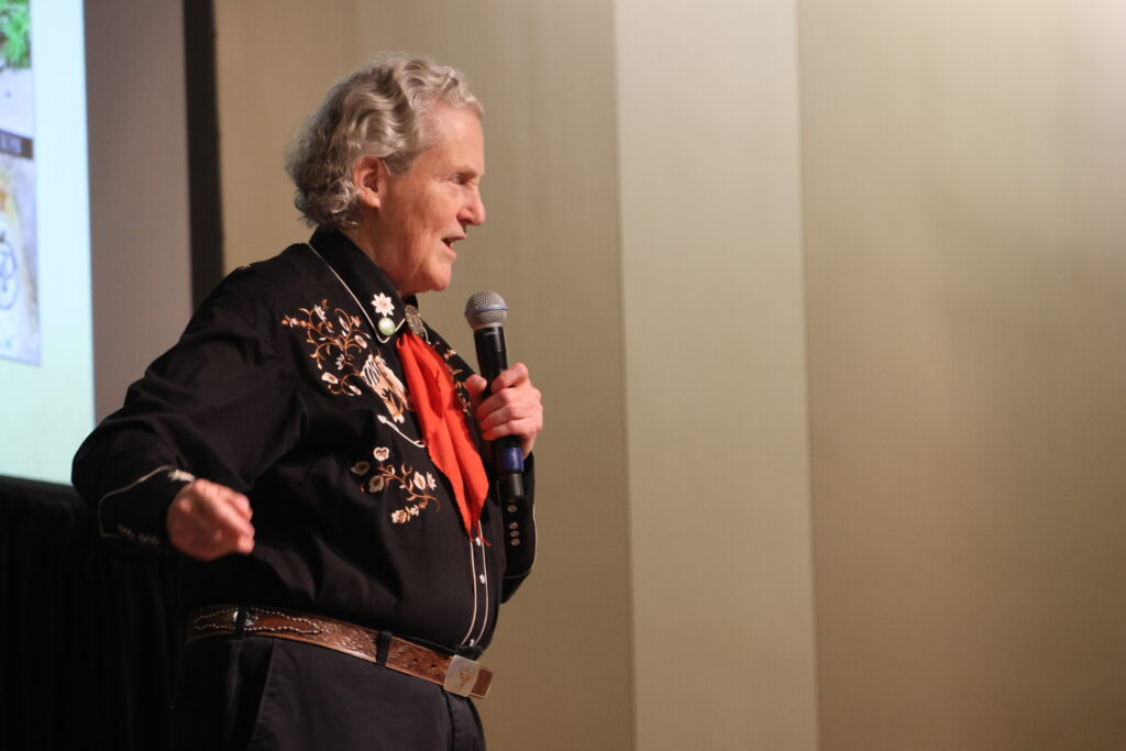 Temple Grandin on stage giving her lecture.