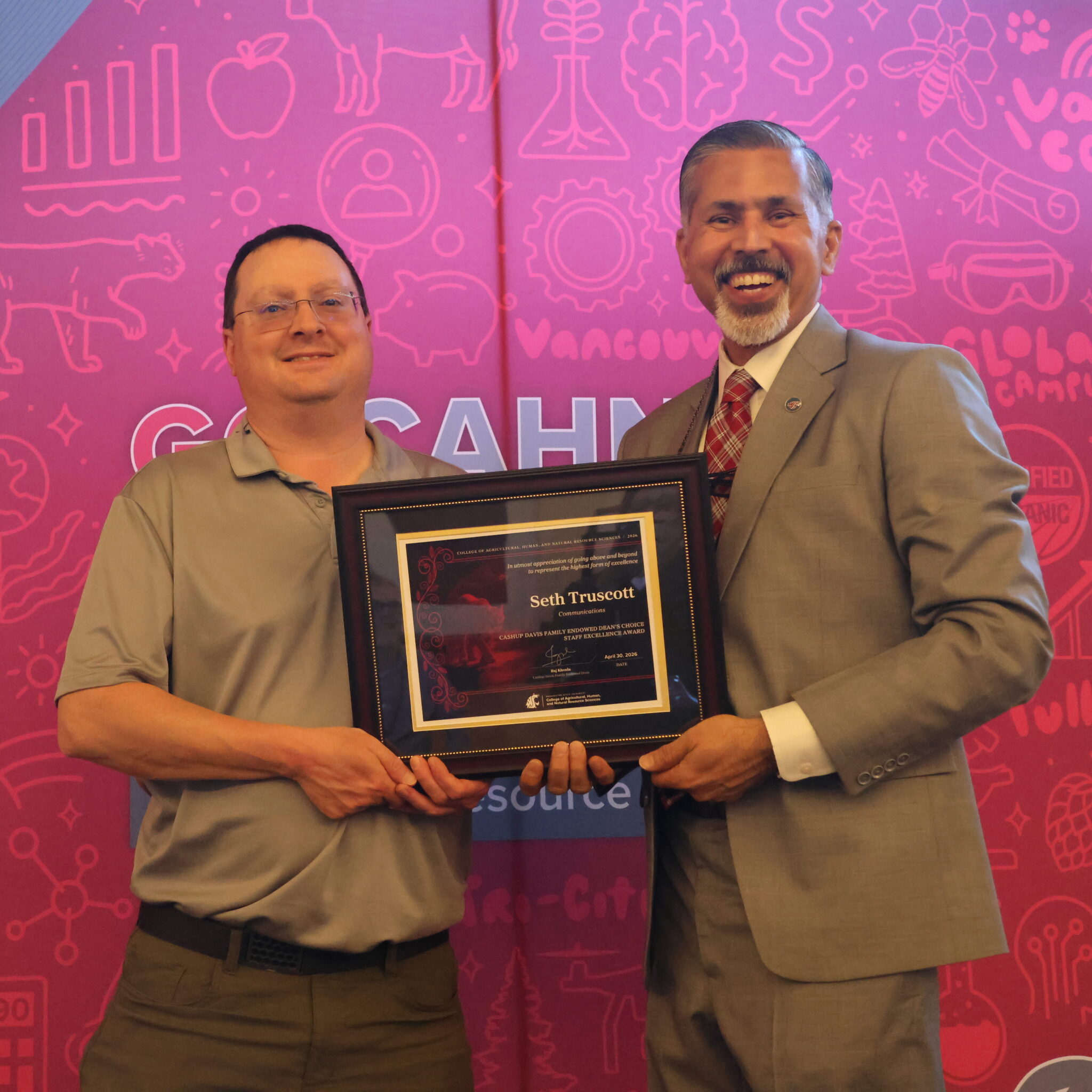 Seth Truscott receiving his award from Dean Khosla.