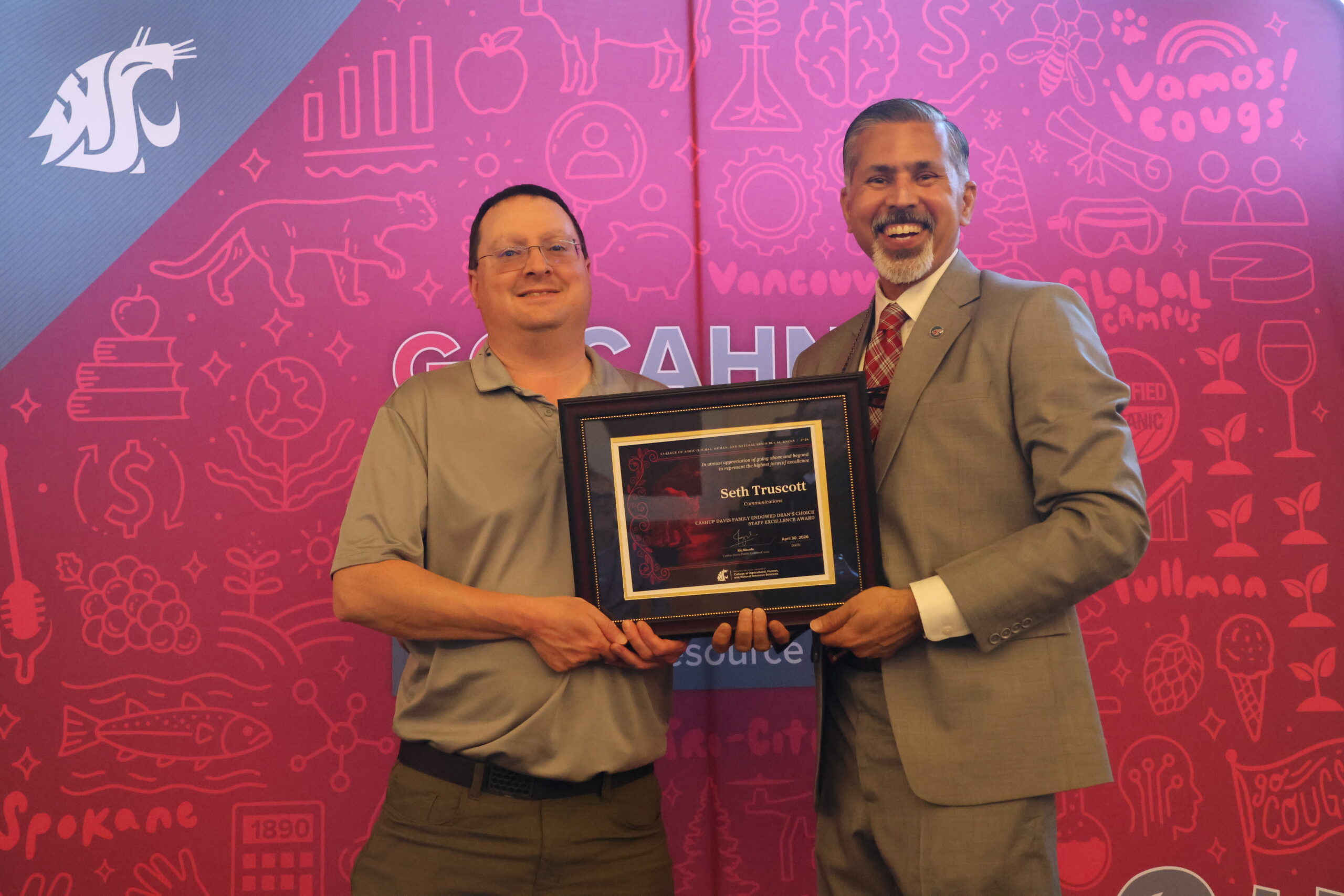 Seth Truscott receiving the Dean's Choice Award from Dean Khosla.