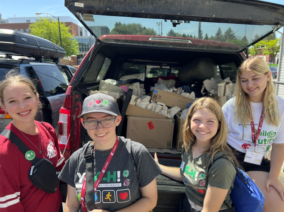 Spokane County 4-H youth participating in the YA4-HI program assemble care kits for children at Ronald McDonald Houses.