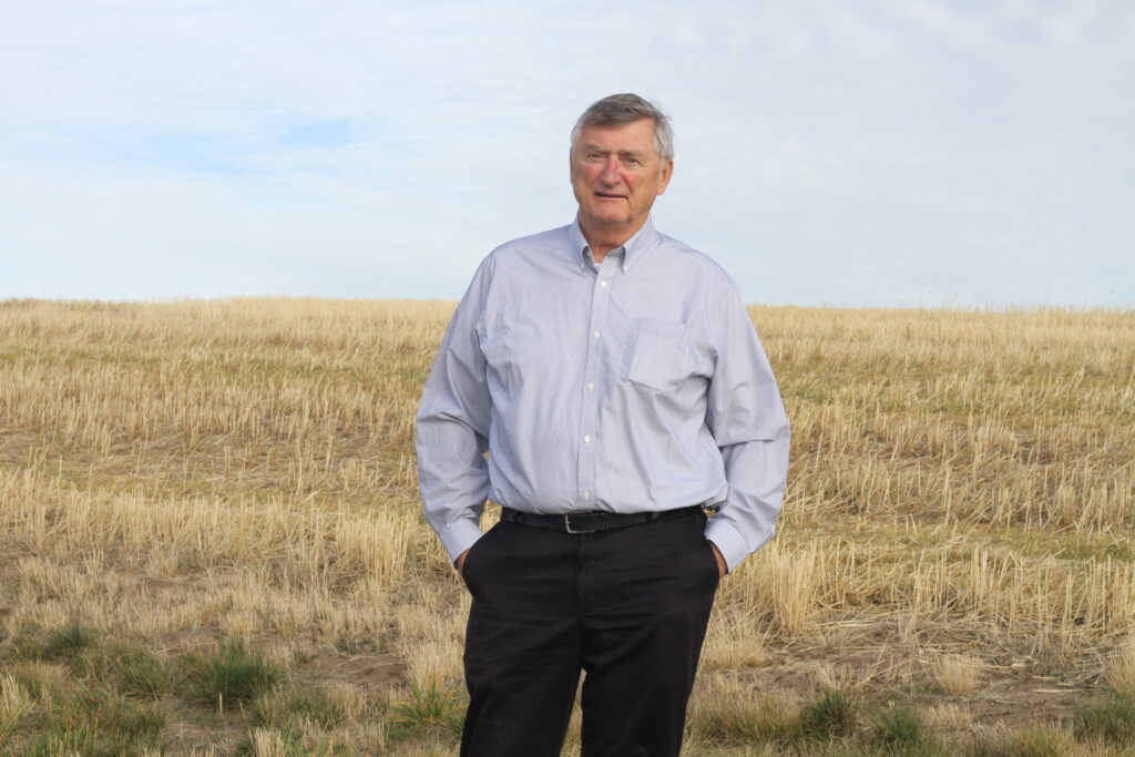 Fred Muehlbauer, retired USDA-ARS pulse breeder at Washington State University, inspects a field of legumes on the Palouse. He helped promote pulses and led breeding efforts at WSU for nearly 40 years. University pulse breeding and research would benefit from a new national endowed chair for pulse crops, says Muehlbauer. (CAHNRS photo)