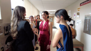 Group of AMDT students preparing for AMDT fashion show.