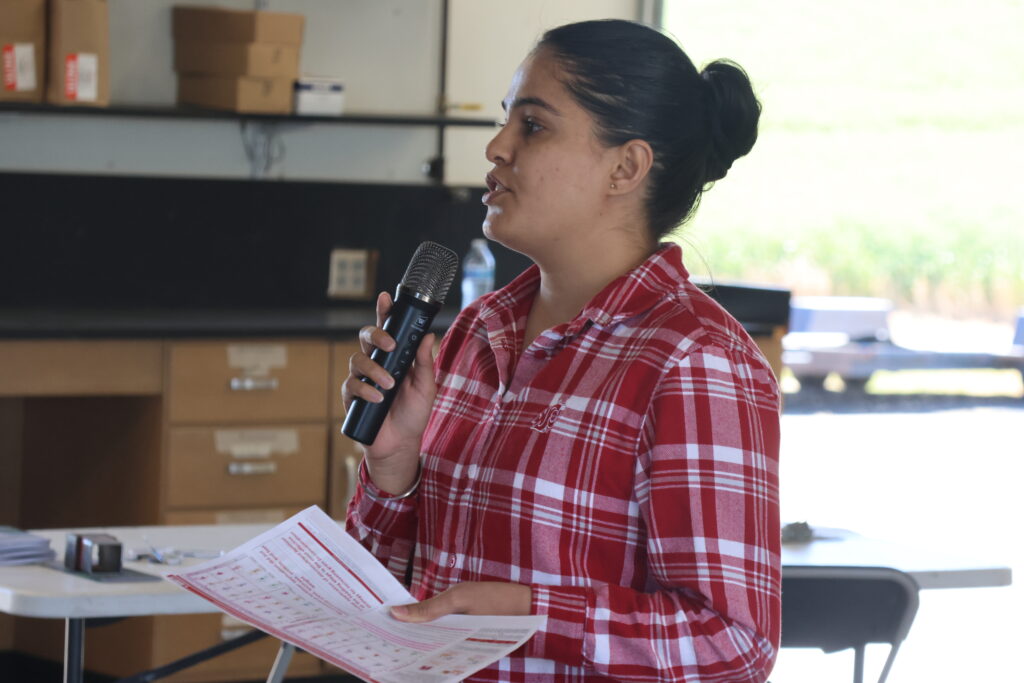 A researcher presenting at a 2026 crop tour.