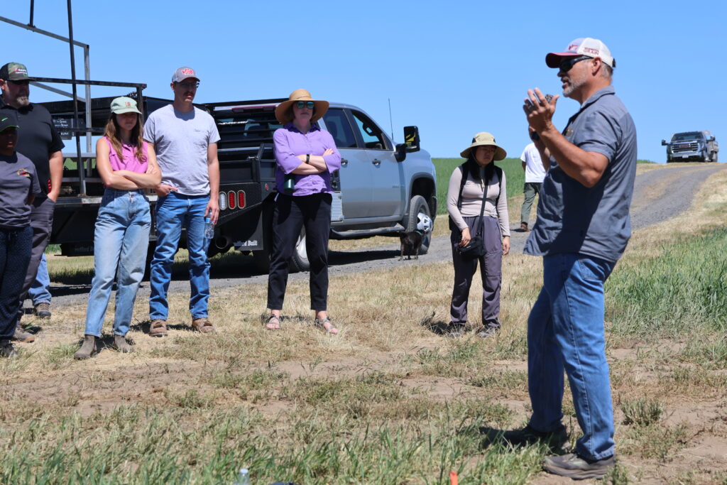 Field day participants talking.