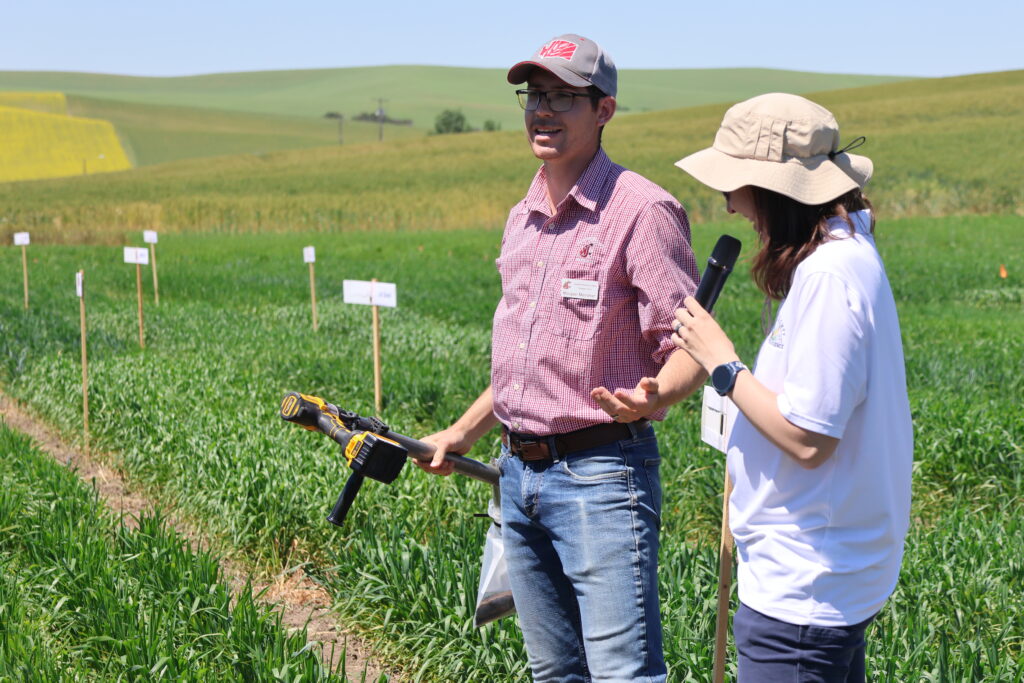 Morgan Menaker and Dr. Olivia Landau speaking at the Spillman Farm Field Day in 2026.