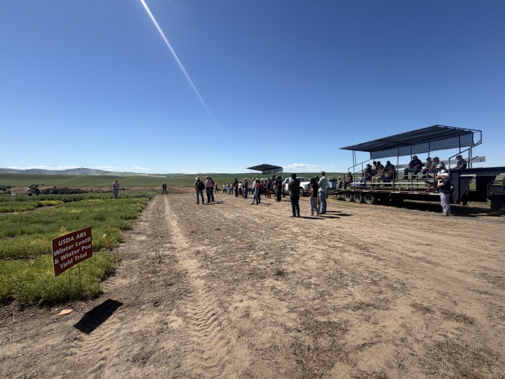 Attendees gather around the the transport trailer at the Spillman Farm Field Day.