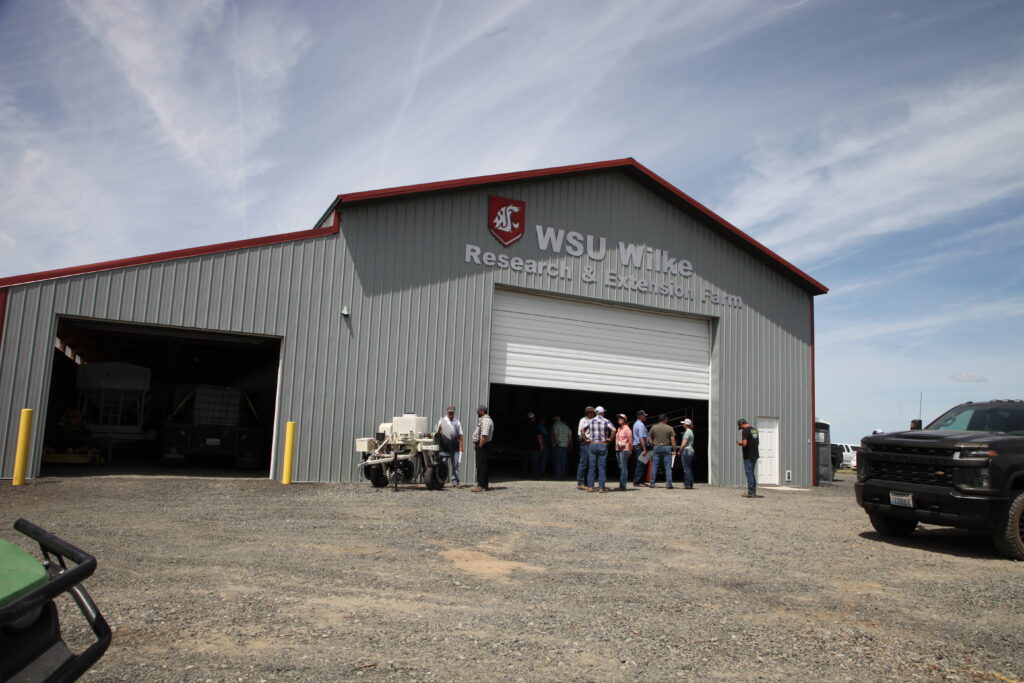 Field day participants standing in front of the building at the WSU Wilke Farm.