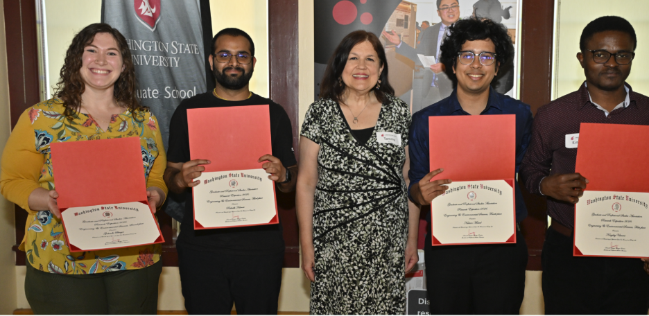 Group of 5 people with four people showcasing received awards.