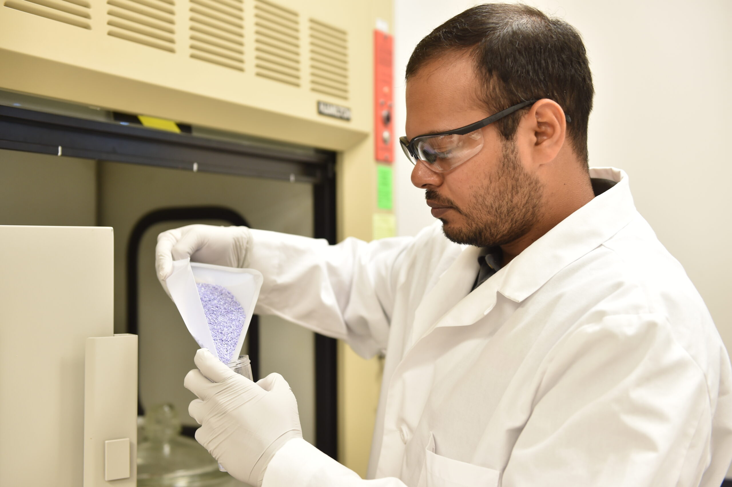 Graduate Student in a lab working.