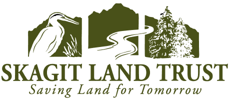 Logo for Skagit Land Trust including a heron, a river, and conifer trees