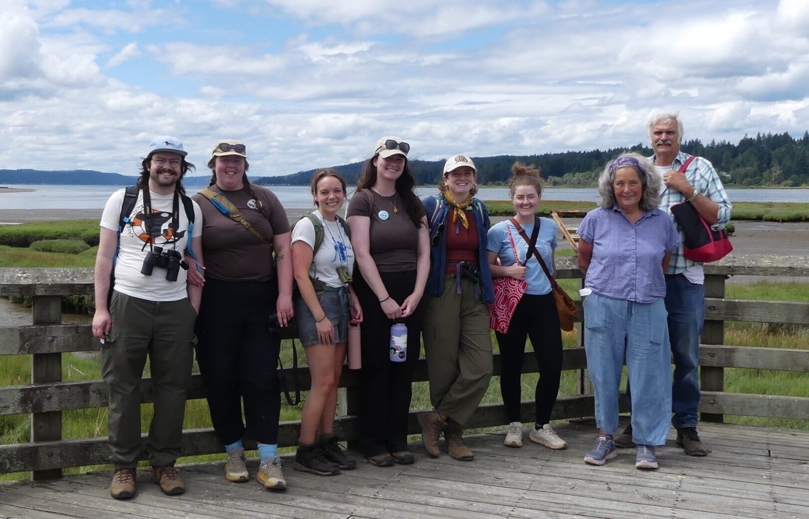 Group of Washington State Naturalists on a boardwalk on an estuary.