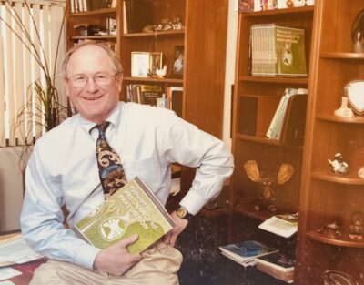 Senger holding book, 1990s