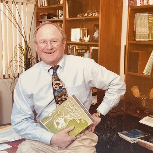 Senger holding book, 1990s