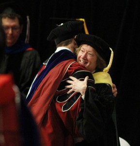 Kris Johnson, interim chair of Animal Sciences, hugs a graduating doctoral scholar.