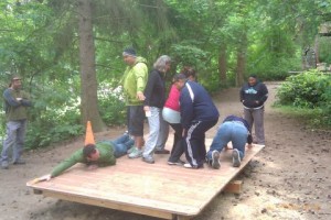 A group tries to get everyone on the balancing platform without letting the sides touch the ground. (Photos courtesy of Scott VanderWey, WSU Extension)