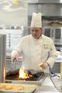 Chef Jamie Callison grills at the WSU teaching center kitchen.