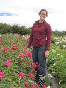 Garfinkel samples peonies in a field.