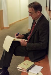 Jones reviews his notes at a bench at FareStart.