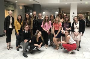 A group photo in the room at Fashion Mart.