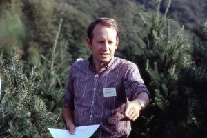 Papers in hand, Curt Moulton tours a Northwest tree farm.