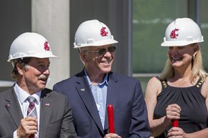 In hardhats, with shovels, Mark Schoesler, Mike LaPlant, and Mary Dye smile following the groundbreaking ceremony.