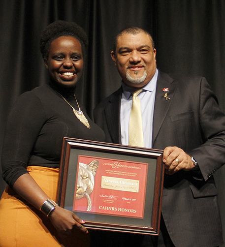 Giramata, left, with Dean Wright, holding framed award.