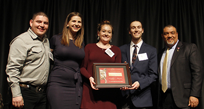 Club members on stage with Dean Wright.