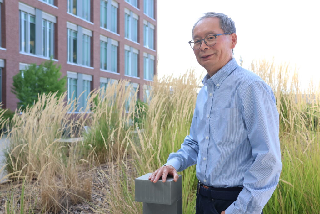 Jiang, pictured outside his laboratory building, near an ornamental grass planting.