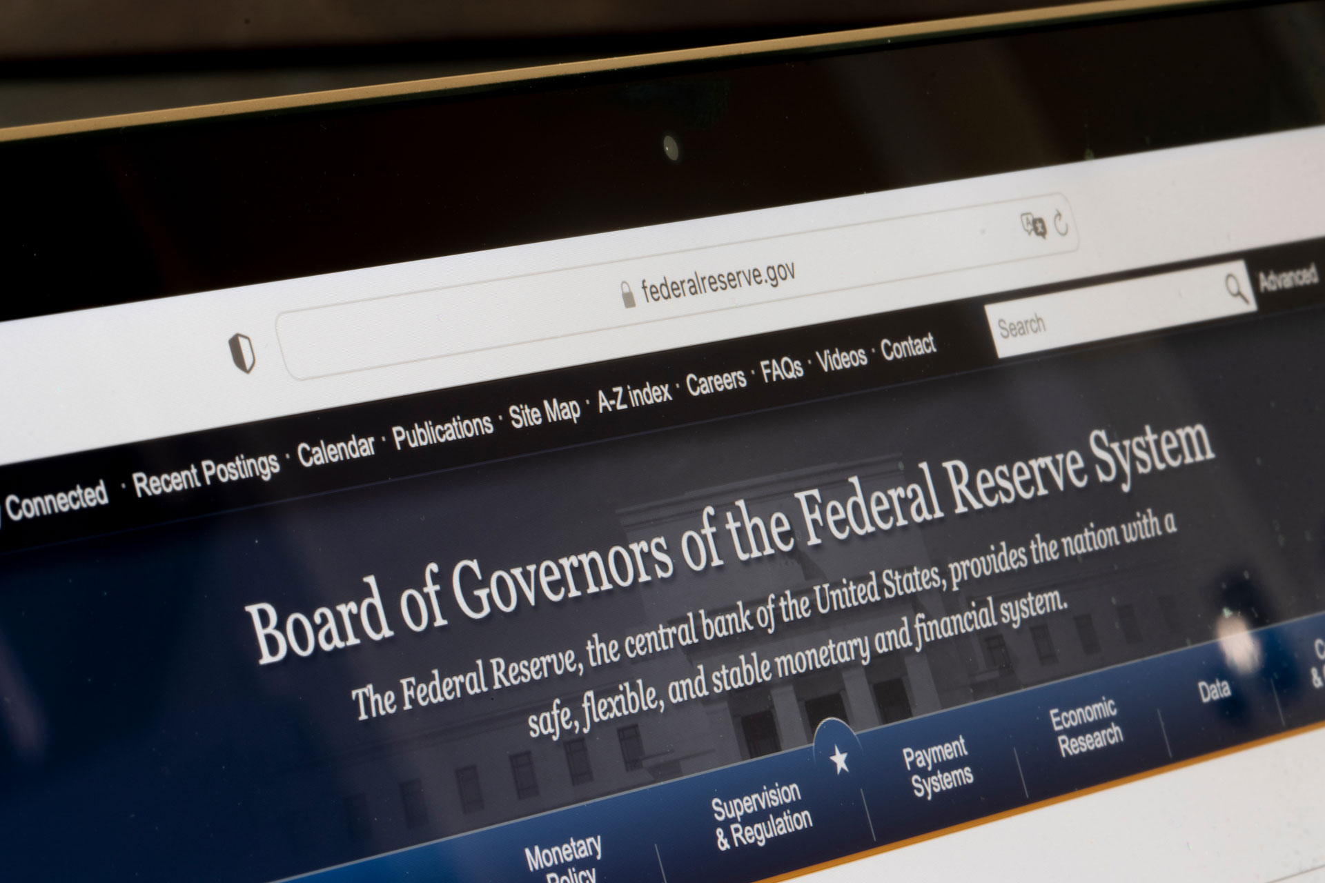 Website homepage of the Federal Reserve is seen on a computer. The Board of Governors is the governing body of the Federal Reserve System, the U.S. central bank. "Board of Governors of the Federal Reserve Systems. The Federal Reserve, the central bank of the United States, provides the nation with a safe, flexible, and stable monetary and financial system.