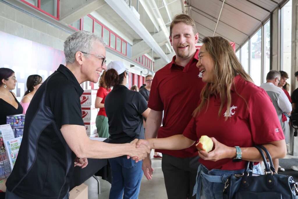 Dr. Kate Evans interacts with couple in move-in event