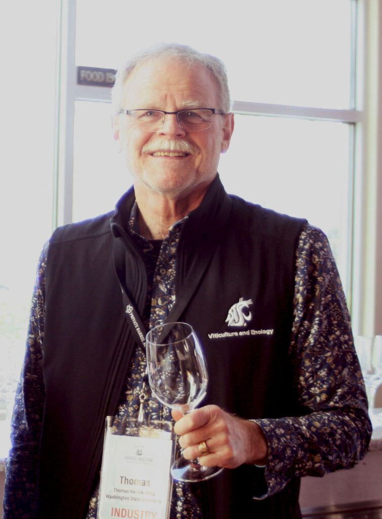 Thomas Henick-Kling holding an empty wine glass.